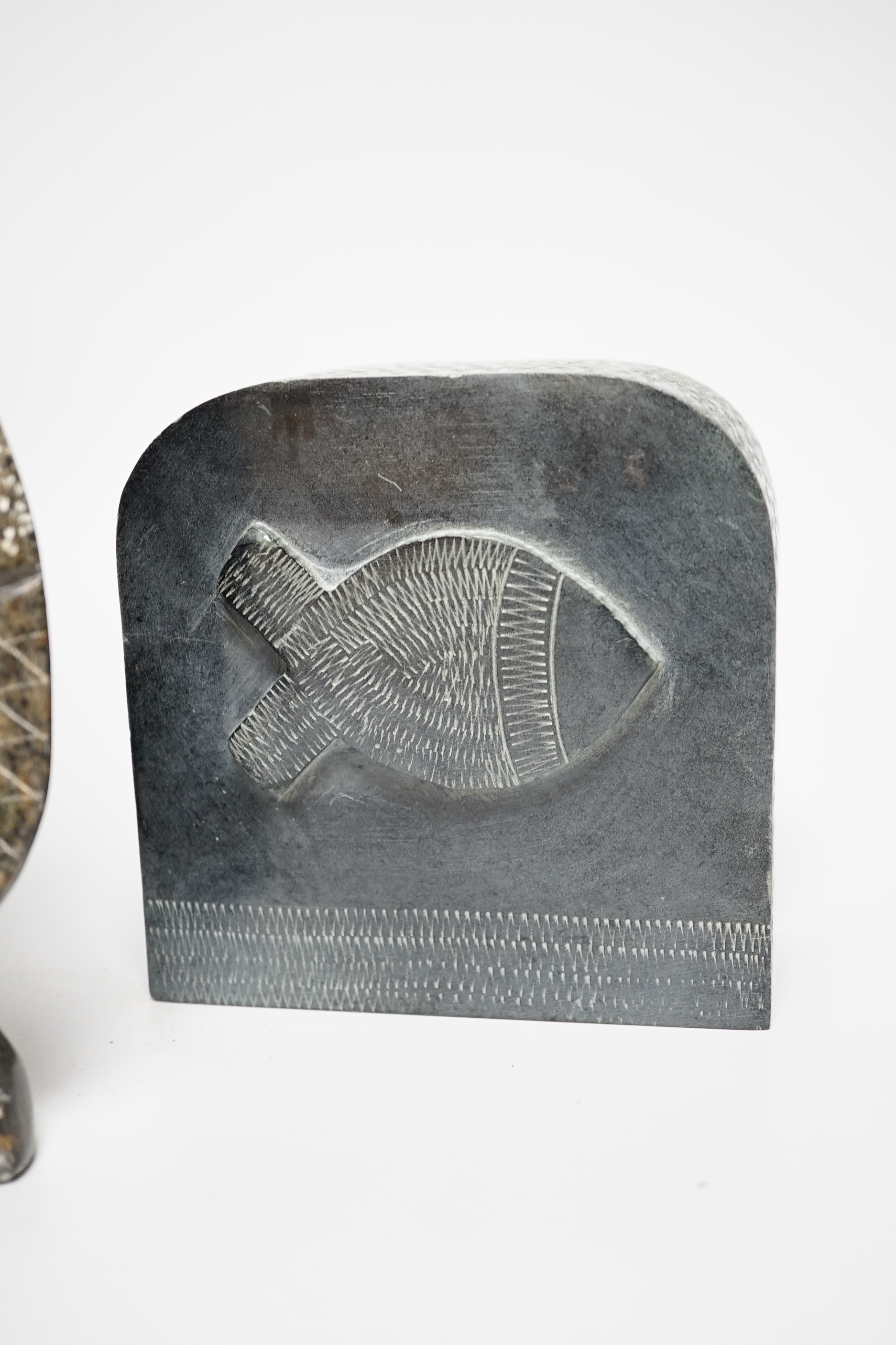 Three Eskimo Inuit soapstone carvings including a bird and fish, the largest 23cm high